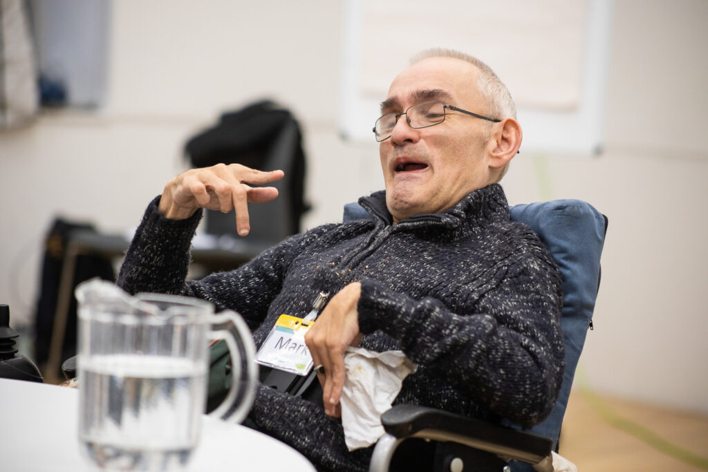 An image of Mark Lynes, a male wheelchair user, at the Shaping Our Lives Conference Nov 2022